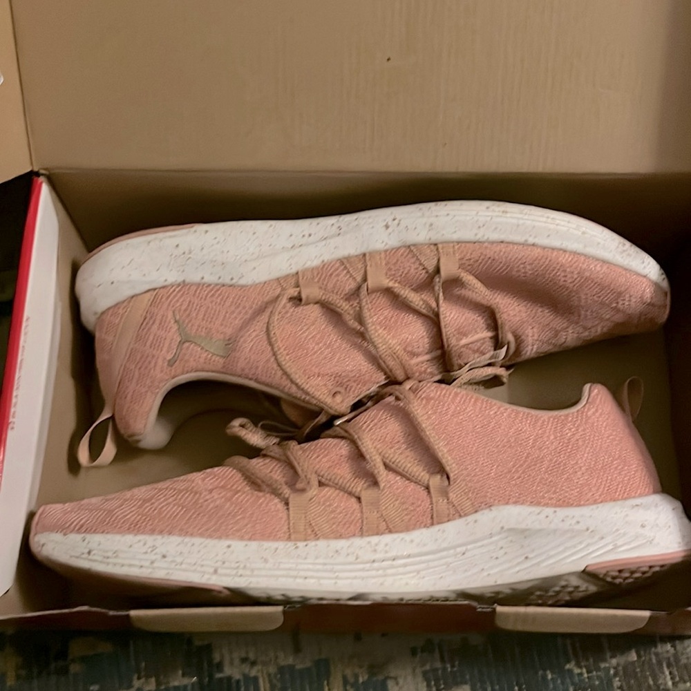 Gently warn Pink Puma sneakers.